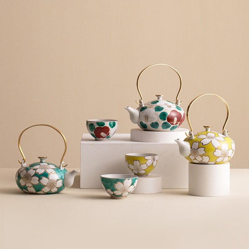 Japanese Arita ware teapot with floral patterns and gold handle