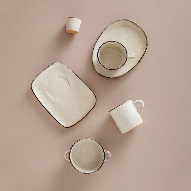 Handmade StudioM coffee cup and saucer with rustic white glaze
