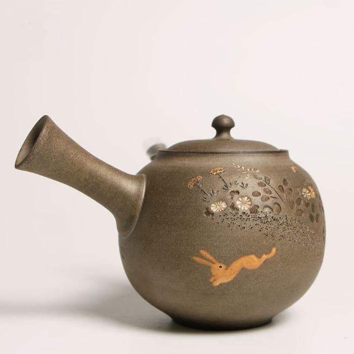 Close-up of Tokoname pottery teapot with engraved moon rabbit motif