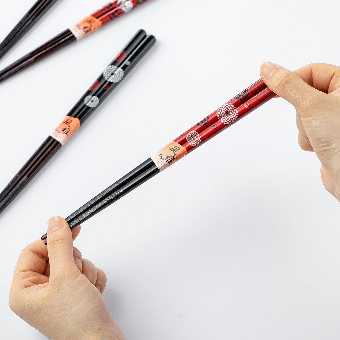 Japanese handmade couple chopsticks with floral designs on a table