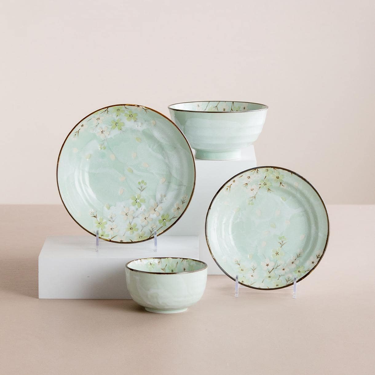 Elegant Japanese ceramic plate with cherry blossom design.