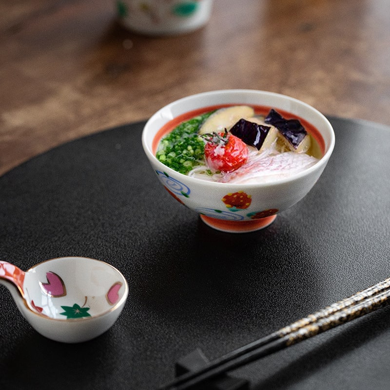 Vibrant strawberry and swirl pattern on Japanese soup bowl