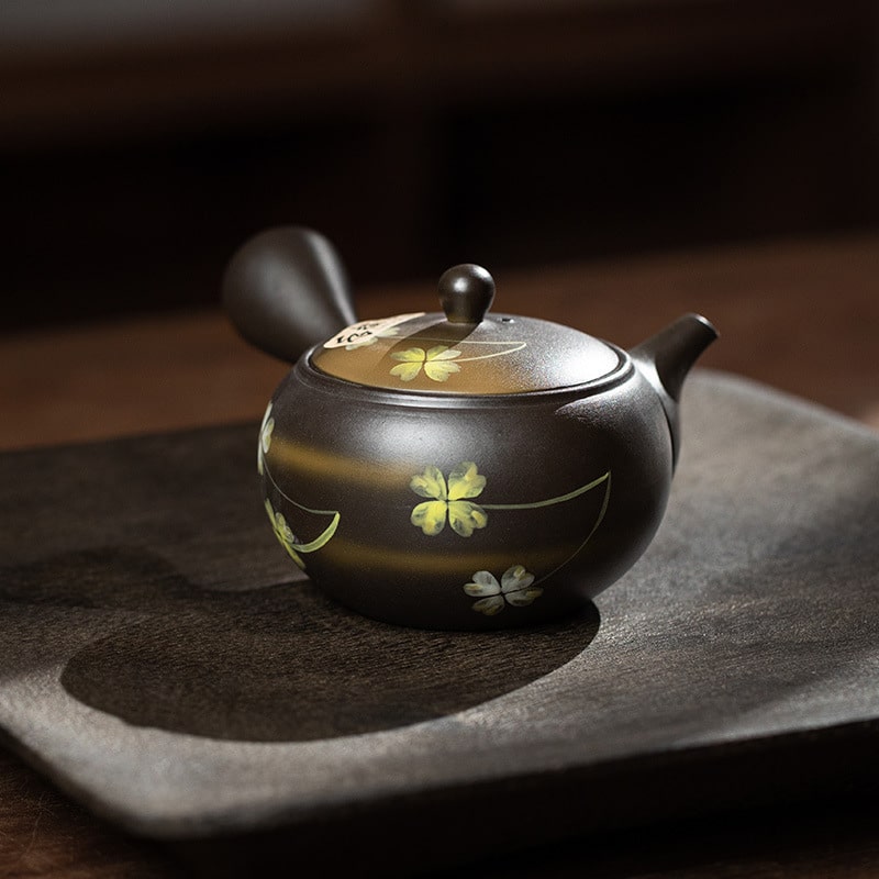 Japanese Tokoname ware side-handle teapot on wooden surface