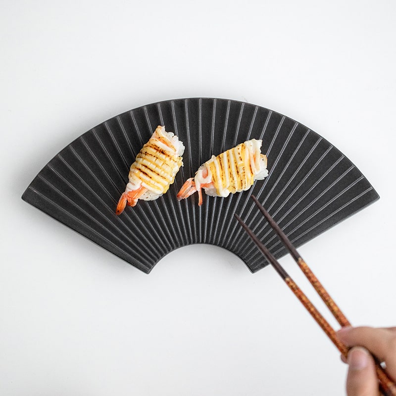 Green fan-inspired high-end dining plate for sushi.