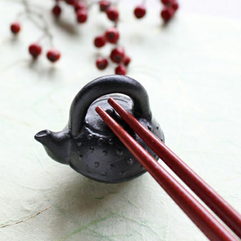 Handmade Japanese ceramic chopstick holder shaped like a mini iron kettle