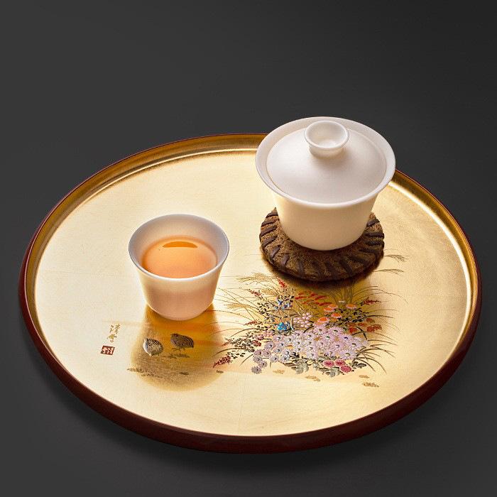 Handcrafted Japanese gold foil lacquer tray on display