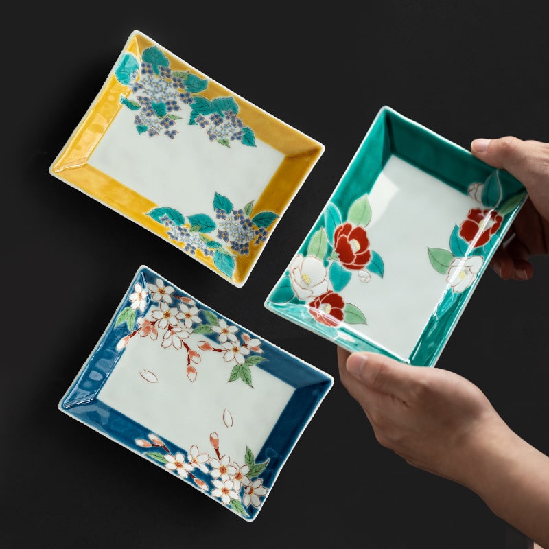 Set of floral rectangular ceramic plates featuring vibrant colors.