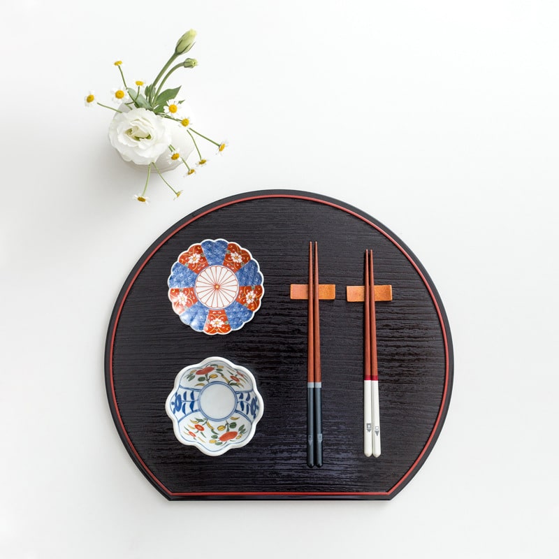 Pointed design chopsticks on a minimalist dining table.