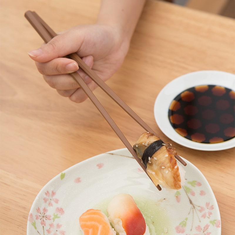 Assorted pointed wooden chopsticks with intricate designs
