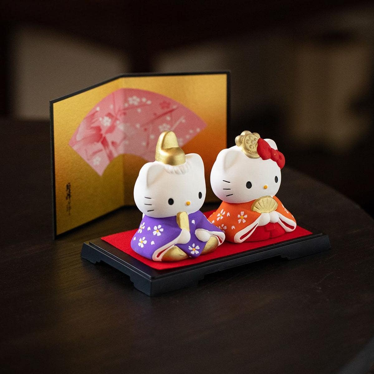 Japanese Hello Kitty figurines in vibrant traditional costumes