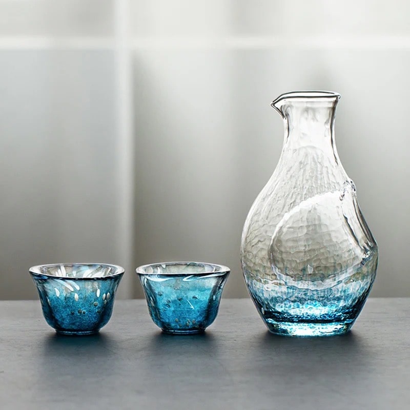 Elegant glass sake set with a blue gradient and hammered texture.