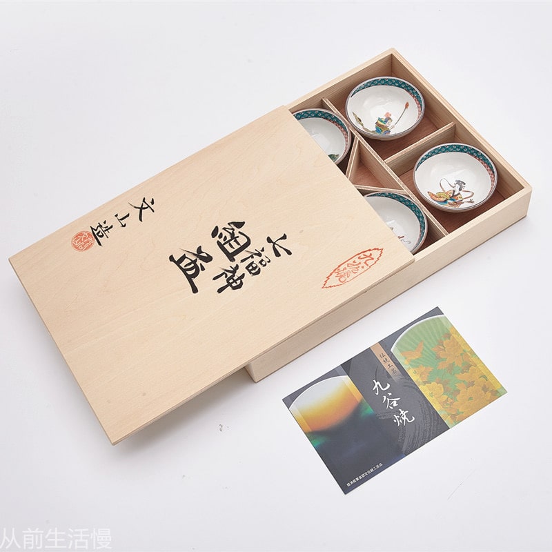 Hand-painted Japanese tea cup set with folklore designs in a wooden gift box.