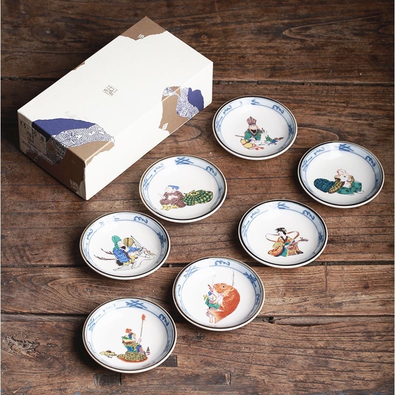 Hand-painted Japanese tea cup set with folklore designs in a wooden gift box.
