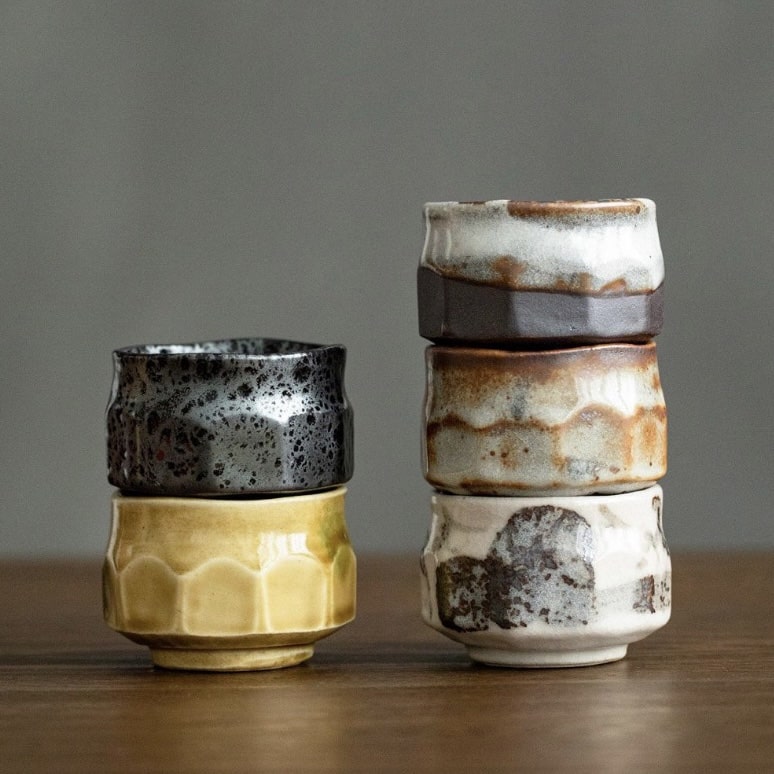 Rustic artisan tea set featuring unique handcrafted designs.