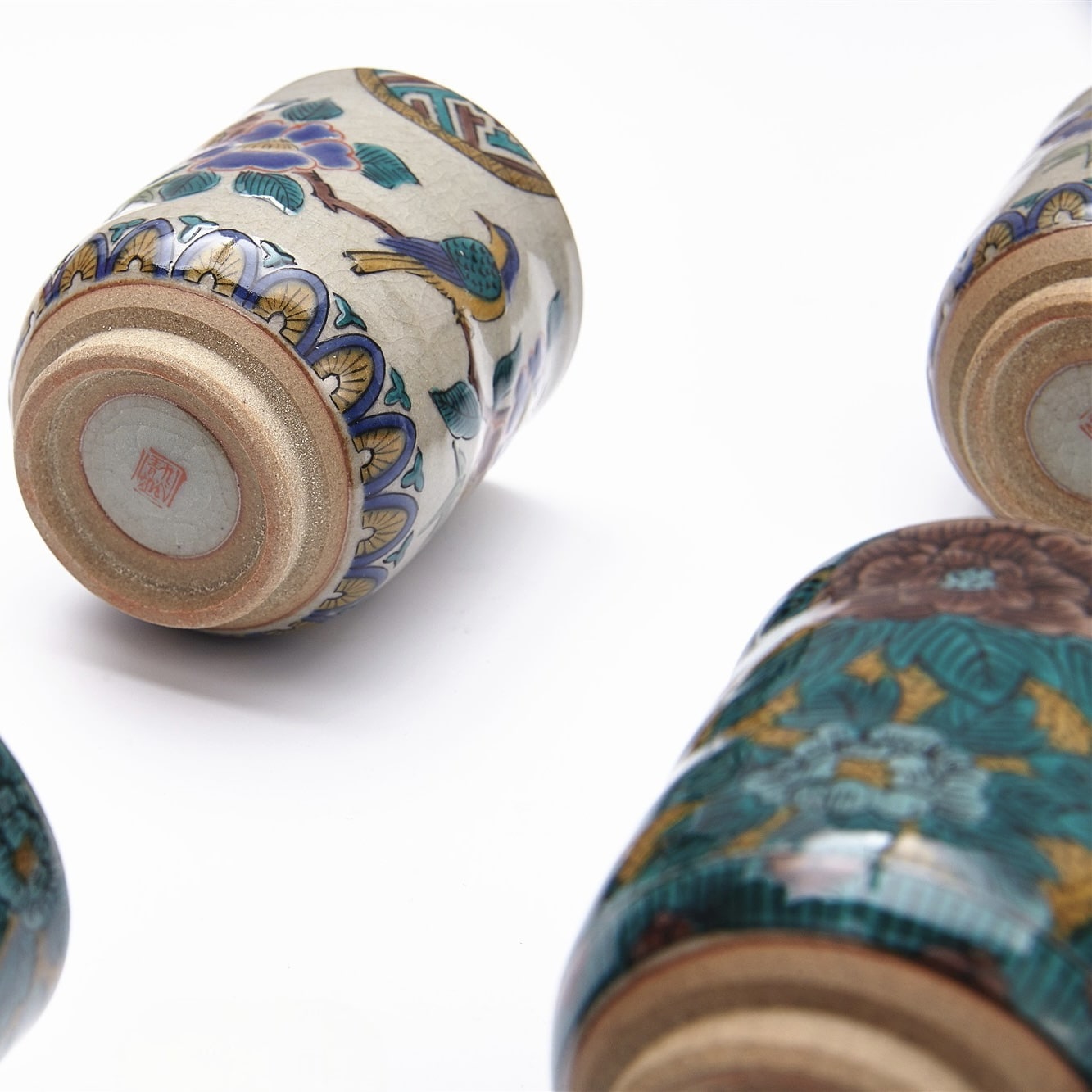 Handcrafted Japanese Ceramic Tea Cups with Bird and Floral Motif