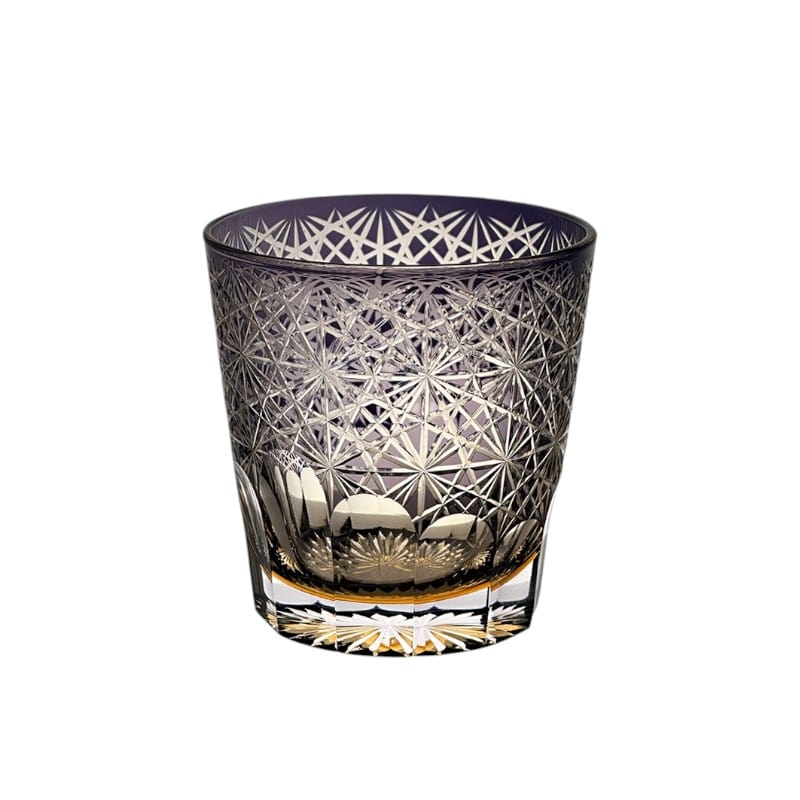 Close-up of handcrafted purple whiskey glass showcasing intricate Edo Kiriko daisy design.
