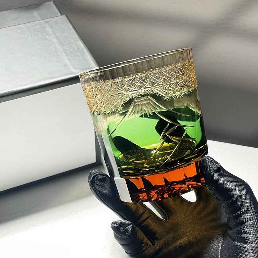 Mount Fuji whiskey glass with Edo Kiriko crystal cut design and vibrant blue-green palace-inspired motif.