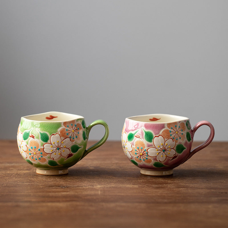 Kutani-yaki hand-painted floral mug on wooden table
