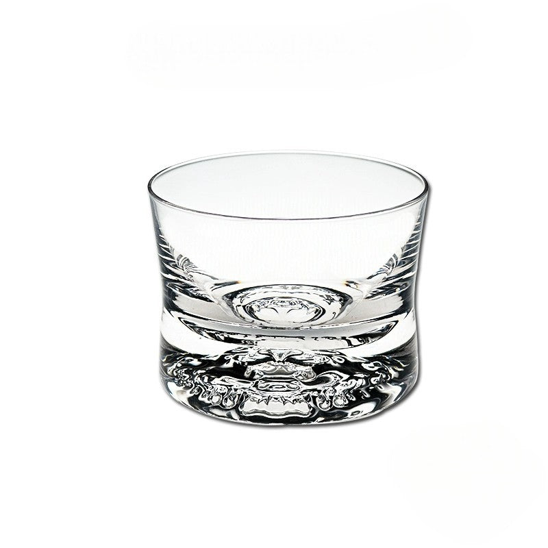 Minimalist crystal whiskey glass with intricate weighted base, 300mL capacity.