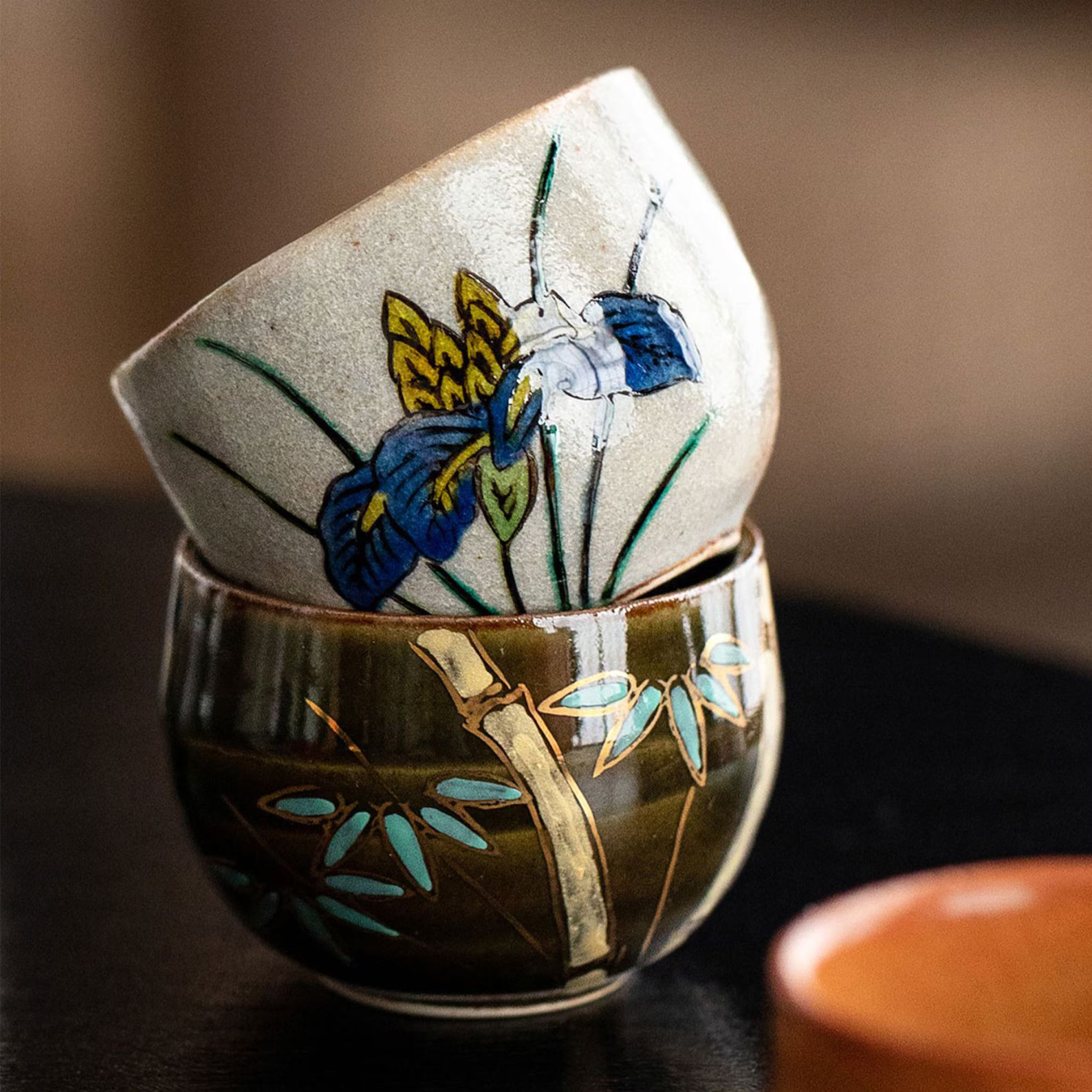 Artisan Japanese tea cups in vibrant ceramic glazes.