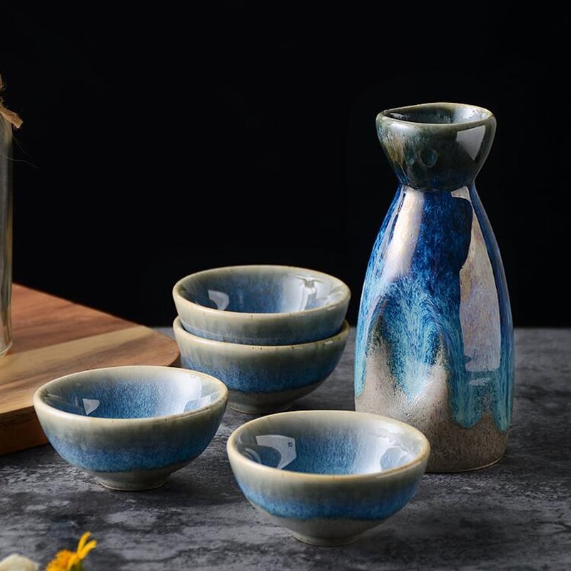 Ceramic sake set with ocean-inspired blue gradient design.