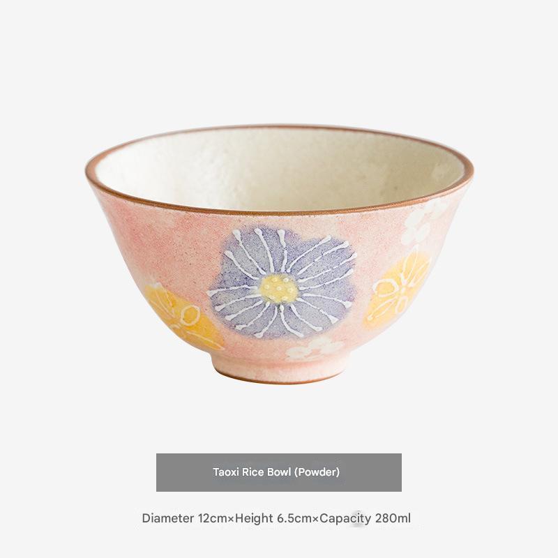 Artisan-crafted ceramic bowls arranged to highlight their intricate blossom design