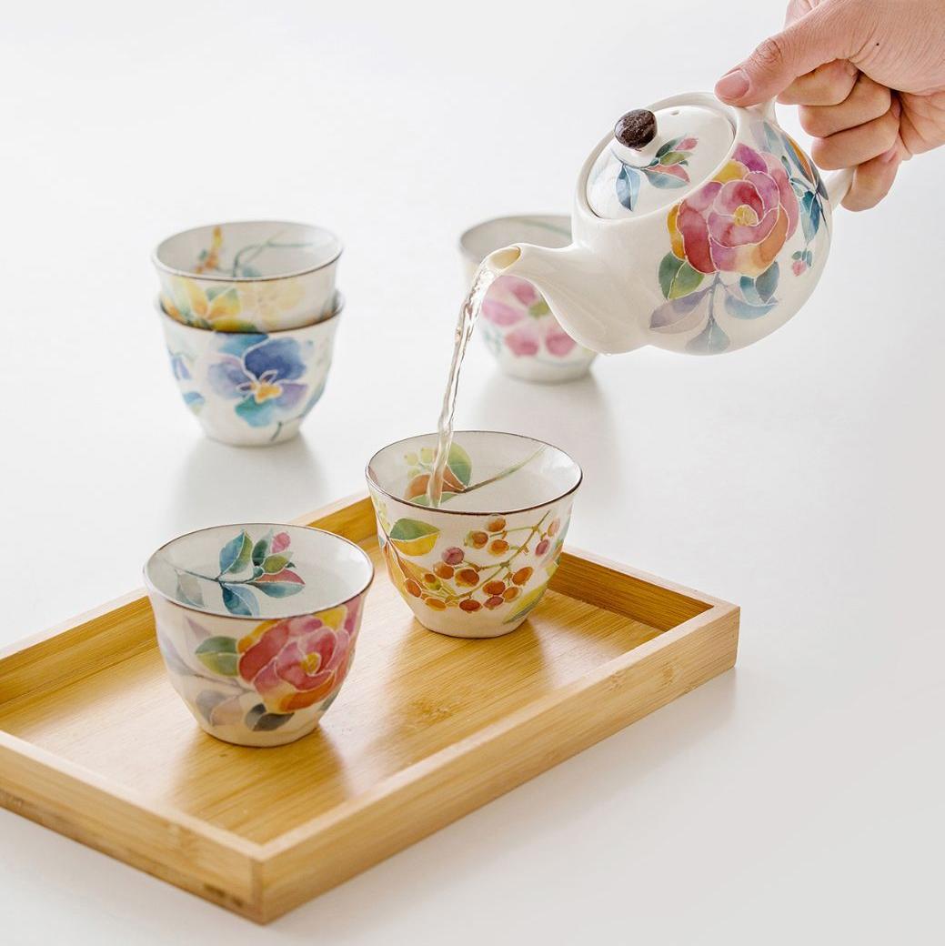 Close-up of hand-painted floral teacup with intricate details