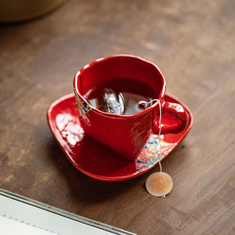 Japanese red Mino ware ceramic coffee mug with floral design