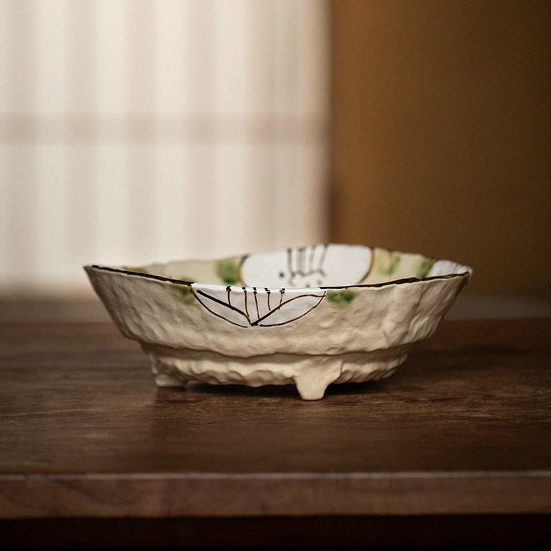 Handcrafted Mino Ware bowl with spring flower motifs.