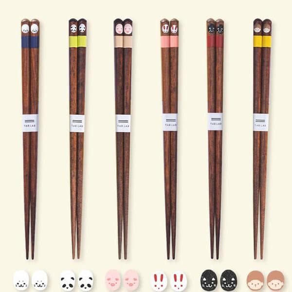 Colorful animal-themed wooden chopsticks arranged in a set