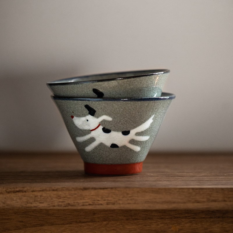 Handcrafted ceramic bowls with playful dog design