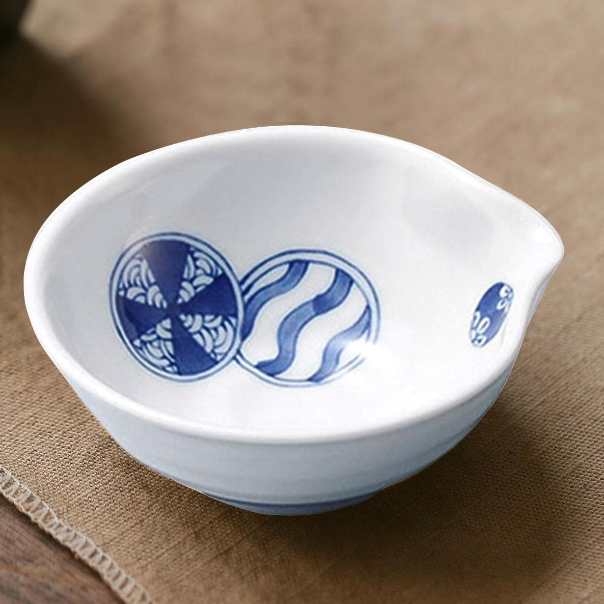 Close-up of a red and blue patterned Hasami-yaki bowl