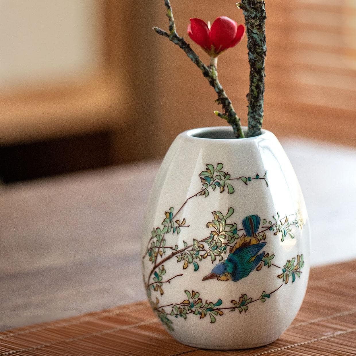 Small Kutani ware vase featuring intricate hand-painted details