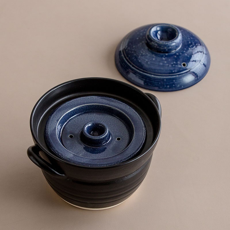 Open Japanese sand pot showing double-layered lid design.