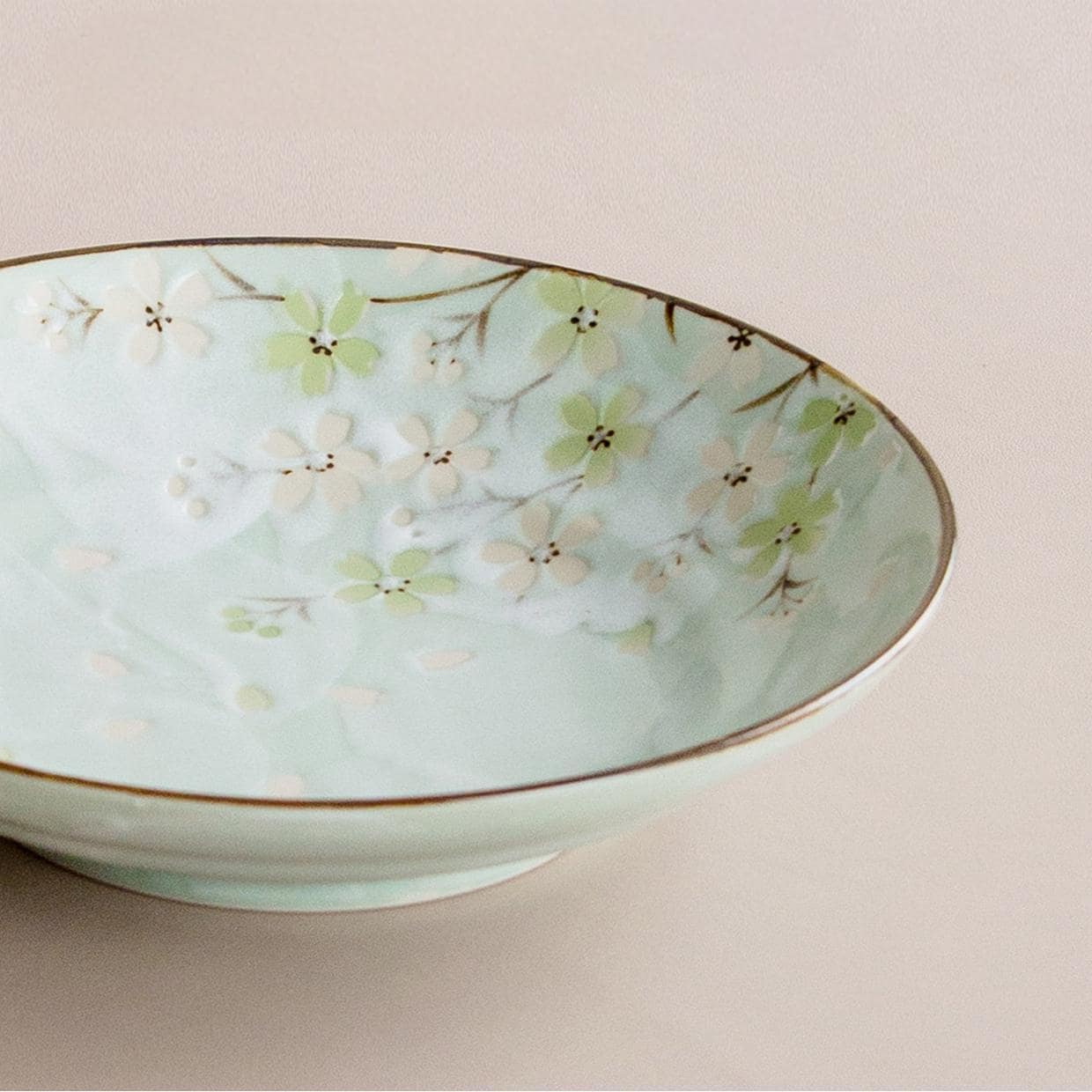 Close-up of cherry blossom motif on Mino Ware dinner plate.