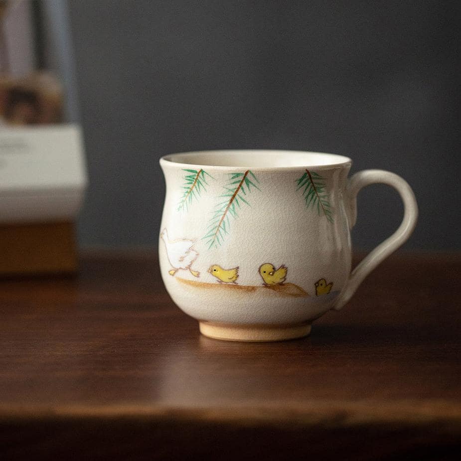 Playful ceramic cup with colorful aquatic animal illustrations.