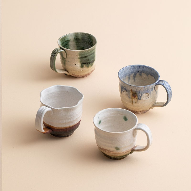 Handcrafted ceramic cups with rustic finishes