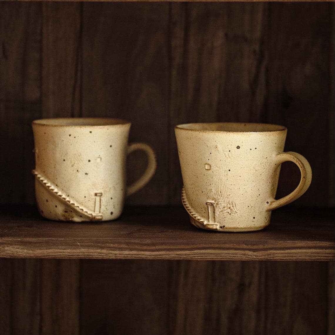 Handmade artisan mug on a wooden table.