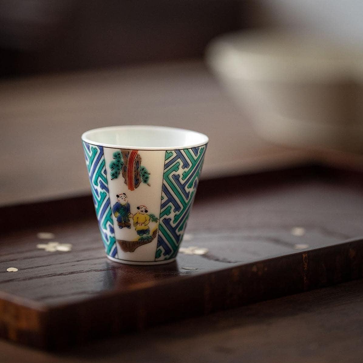 Set of Japanese porcelain cups with vibrant patterns