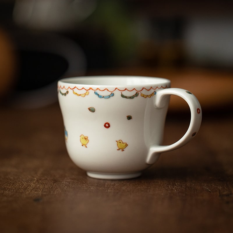 Hot air balloon-themed ceramic mug close-up on a table