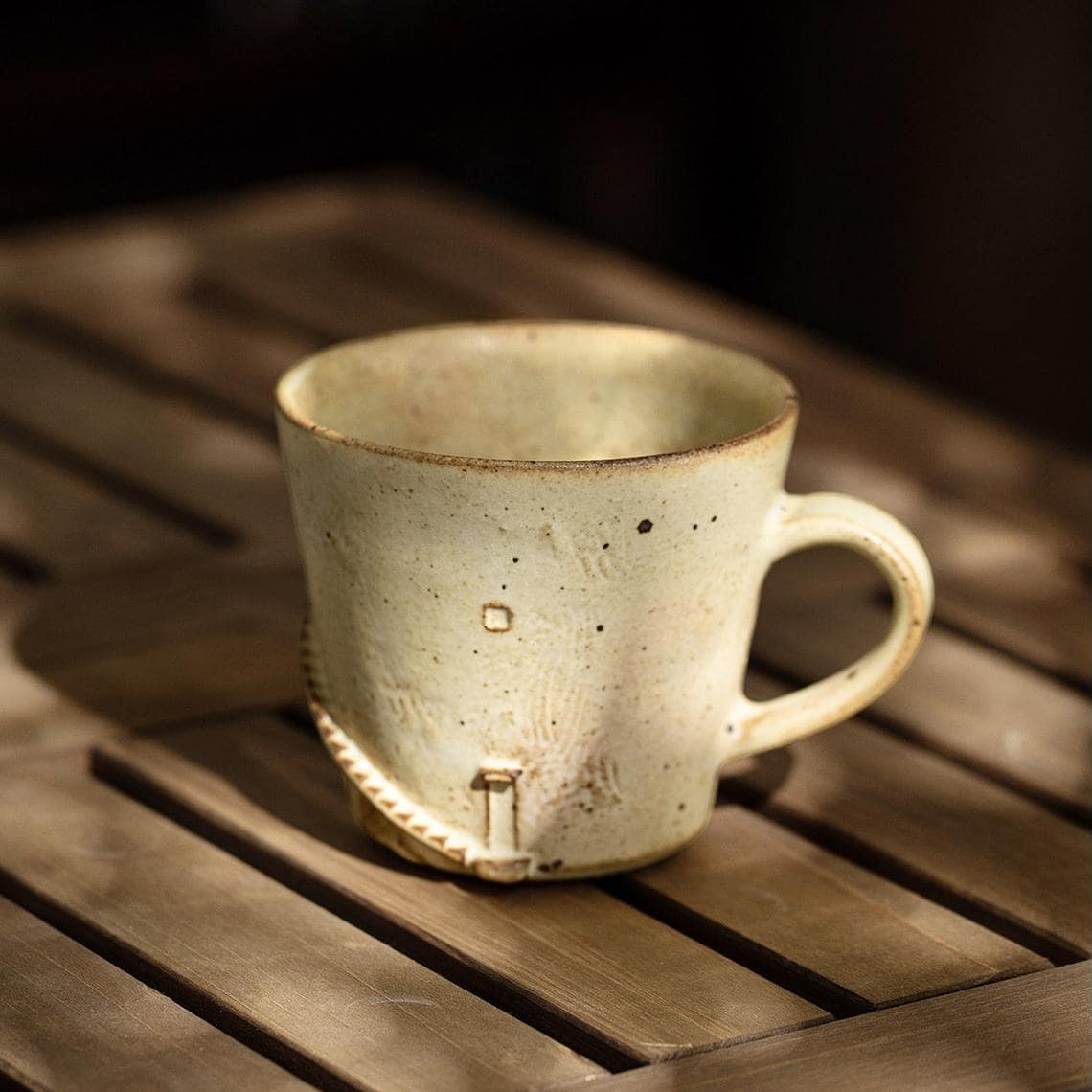 Close-up of handcrafted rustic coffee mug.