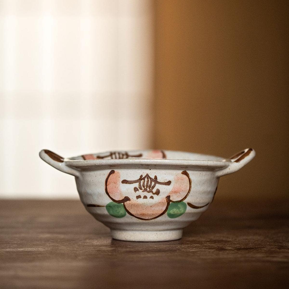 Hand-painted Japanese-style ceramic dishes for dining and serving.