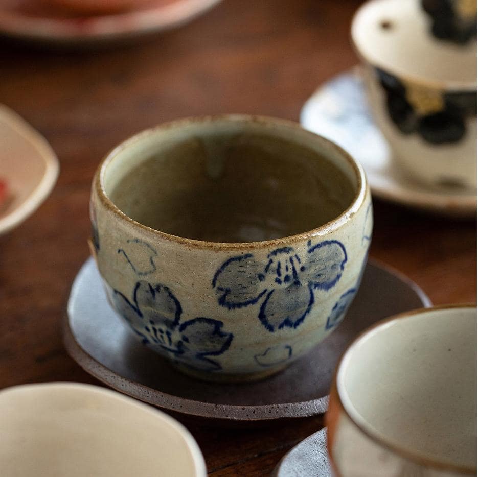 Close-up of hand-painted Japanese ceramic tea cup design