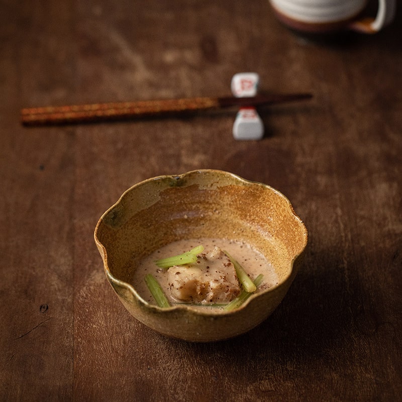 Handcrafted artisan ceramic bowl on rustic table