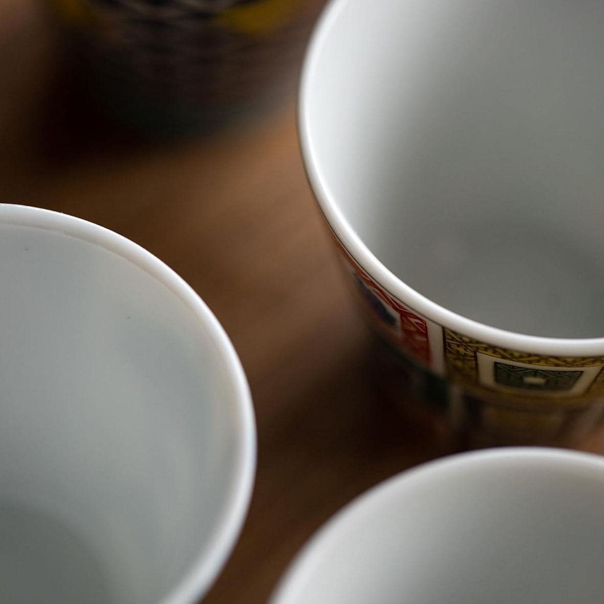 Bottom view of a Japanese porcelain cup showcasing authenticity mark