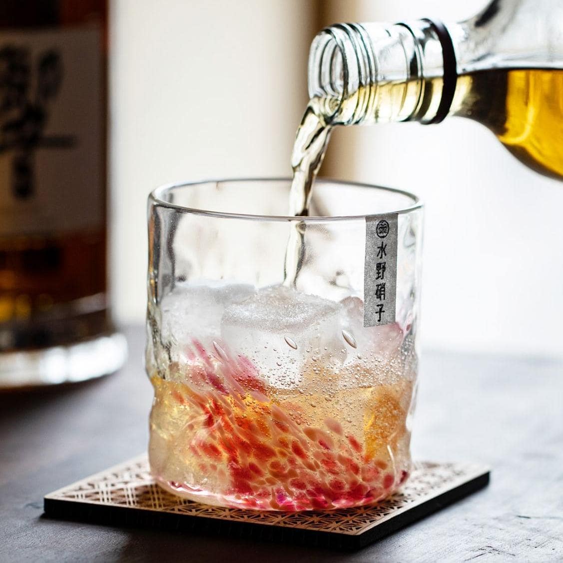 Handcrafted sakura-inspired whiskey glass for elegant use.