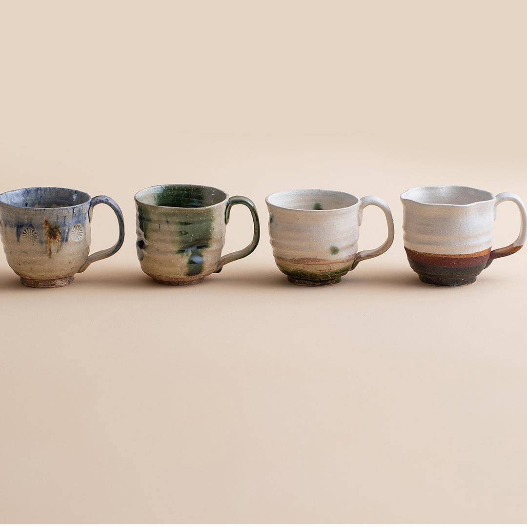 Handcrafted ceramic cups with rustic finishes