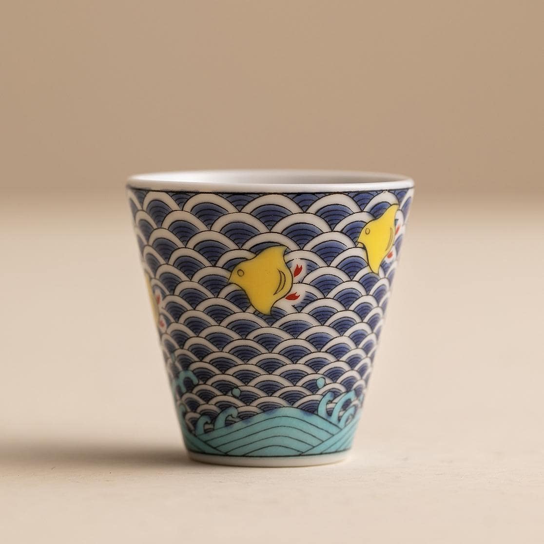 Close-up of a traditional Japanese sake cup with geometric design