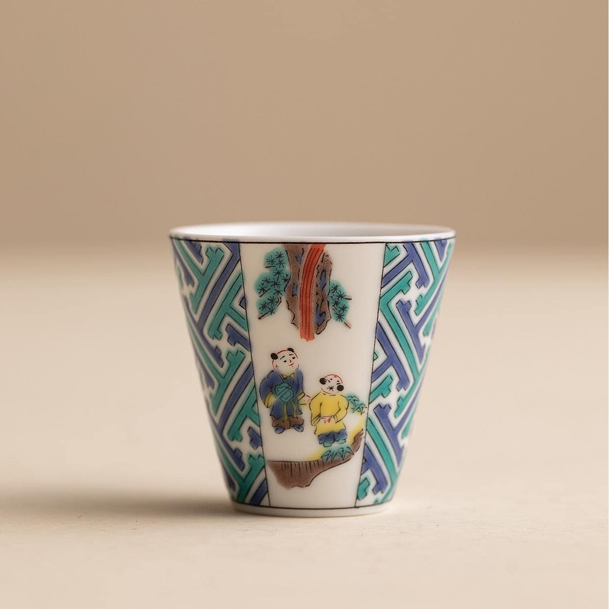 Bottom view of a Japanese porcelain cup showcasing authenticity mark