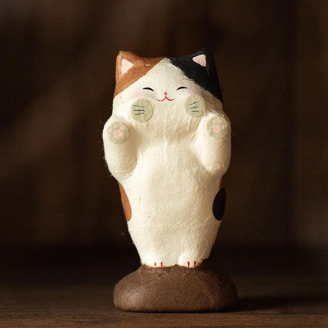 Close-up of a Japanese ceramic cat home décor piece